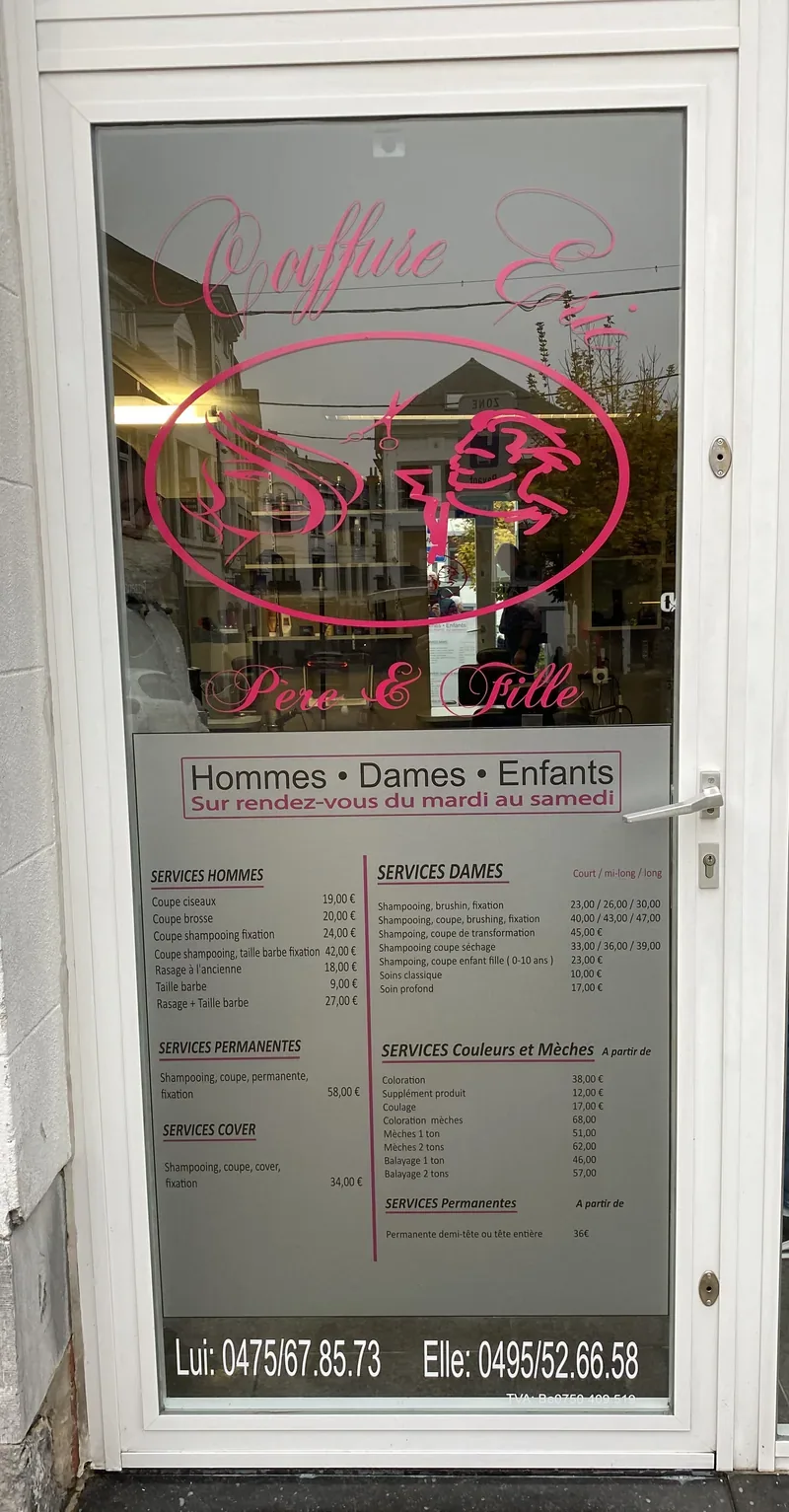 Logo rose et grille tarifaire appliqués en vitrophanie sur la porte d'un salon de coiffure.